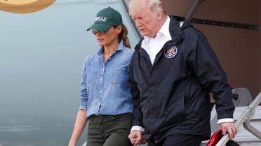 President Donald Trump and first lady Melania Trump deplane after arriving at Ellington Field to meet with flood survivors and volunteers in Houston, on September 2, 2017. (Reuters)