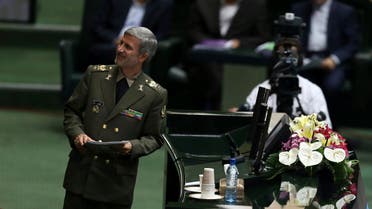 Gen. Amir Hatami arrives at the podium to defend himself in a session of parliament in Tehran, on Aug. 17, 2017. (AP)