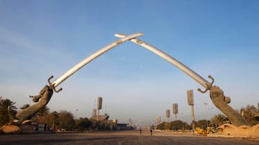 The “Hands of Victory” memorial rises over an empty parade ground in the Green Zone of Baghdad December 14, 2011. (Reuters)