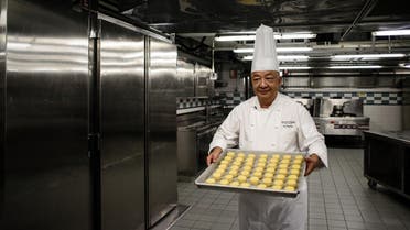 Chef Yip Wing-wah prepares to oven-bake his signature “spring moon mini egg custard mooncakes” at Hong Kong’s Peninsula Hotel. (AFP)
