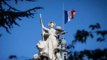 A French flag flies at half-staff on the Grand Palais in Paris, Saturday, Aug. 19, 2017. (AP)