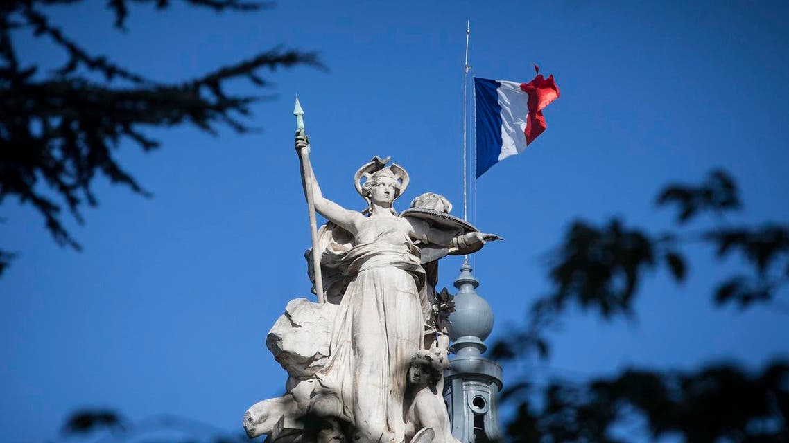 A French flag flies at half-staff on the Grand Palais in Paris, Saturday, Aug. 19, 2017. (AP)