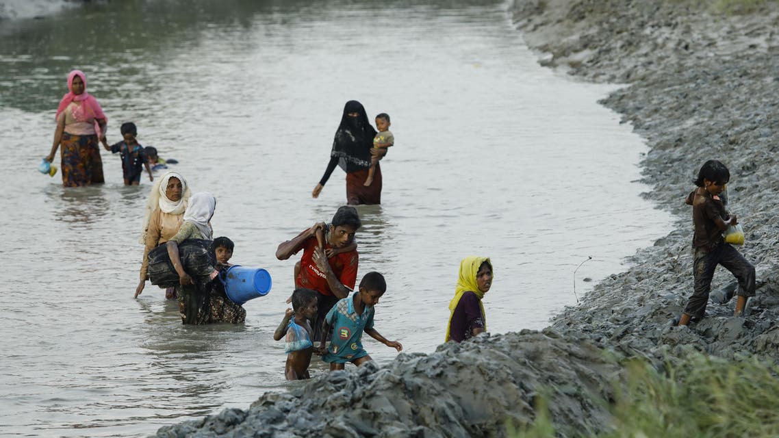 Displaced Rohingya refugees from Rakhine state in Myanmar cross a river near Ukhia, near the border between Bangladesh and Myanmar, as they flee violence on September 4, 2017. AFP