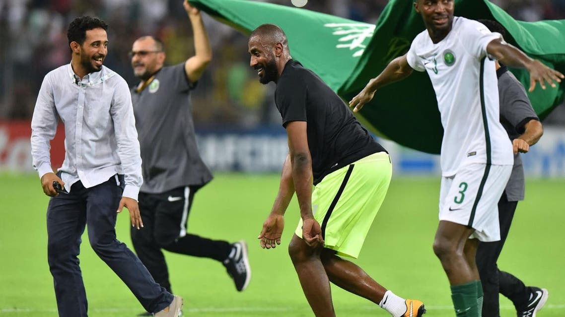 Saudi Arabia's players celebrate after winning the FIFA World Cup 2018 qualification football match between Saudi Arabia and Japan at King Abdullah bin Abdulaziz Stadium in Jeddah on September 5, 2017. (AFP)