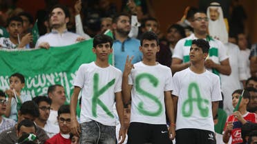 Saudi Arabia's fans cheer during the FIFA World Cup 2018 qualification football match between Saudi and Japan at King Abdullah bin Abdulaziz Stadium in Jeddah on September 5, 2017. (AFP)