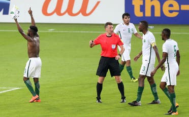 Saudi Arabia's Fhad Al Muwallad, left, celebrates with his teammates scores his side's opening goal. (AP)