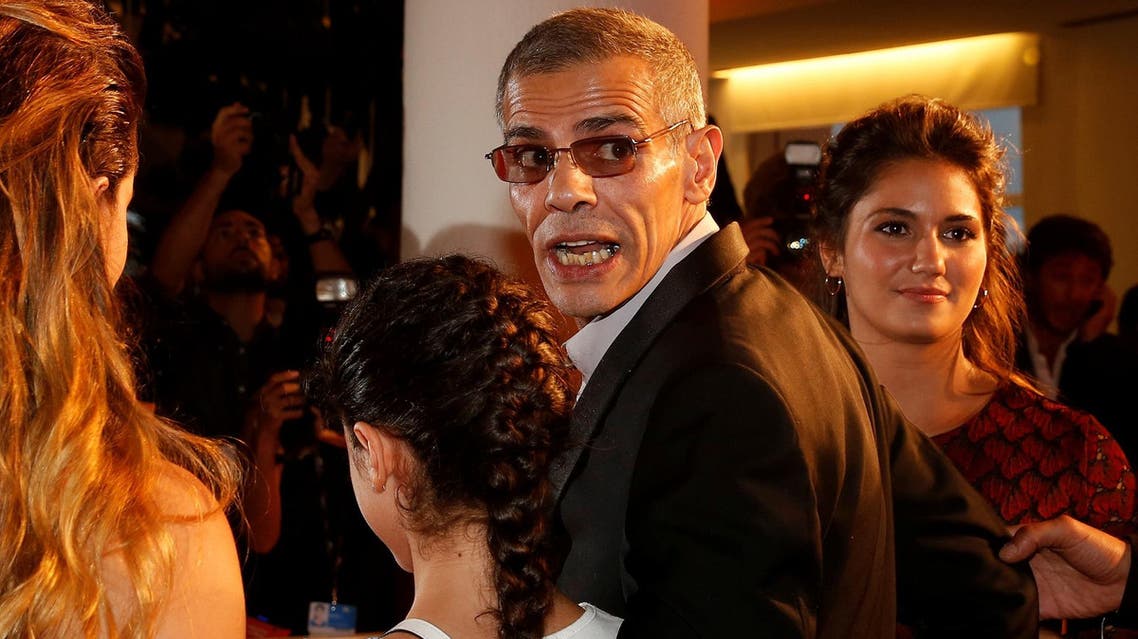 Director Abdellatif Kechiche (2nd to R) poses with actors as they arrive during the red carpet event for the movie on September 7, 2017. (Reuters)