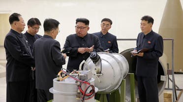North Korean leader Kim Jong Un provides guidance with Ri Hong Sop (2nd L) and Hong Sung Mu (R) on a nuclear weapons program. (AFP)
