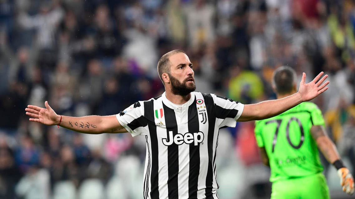 Juventus' Argentinian forward Gonzalo Gerardo Higuain celebrates after scoring during the Italian Serie A football match Juventus vs Chievo at the Allianz stadium in Turin on September 9, 2017. (AFP)