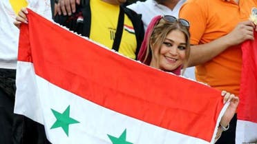 A supporter of Syria's national team attends the FIFA World Cup 2018 qualification football match between Syria and Iran at the Azadi Stadium in Tehran on September 5, 2017. (AFP)