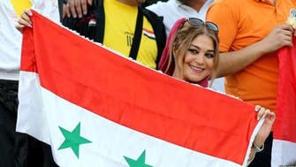 While Iranian female fans were barred, Syrian women filled Azadi Stadium