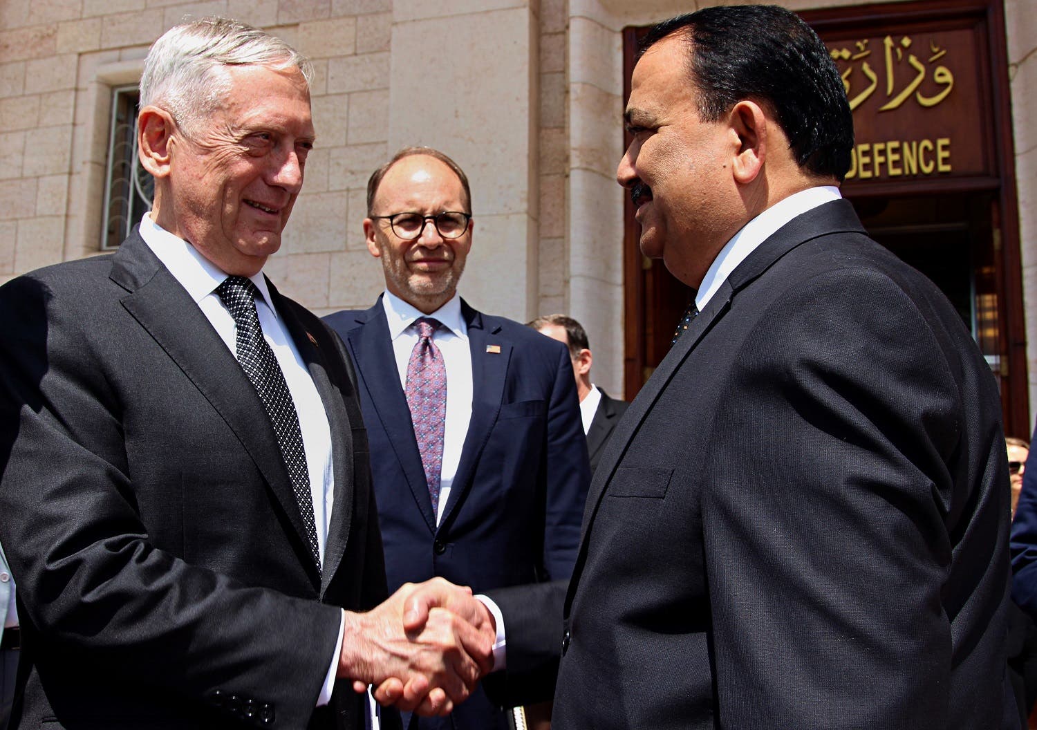 Iraqi Defense Minister Erfan al-Hayali, (right), welcomes US Defense Secretary Jim Mattis (left), and US Ambassador to Iraq Douglas Silliman, to the Ministry of Defense, in Baghdad, on Aug. 22, 2017. (AP)