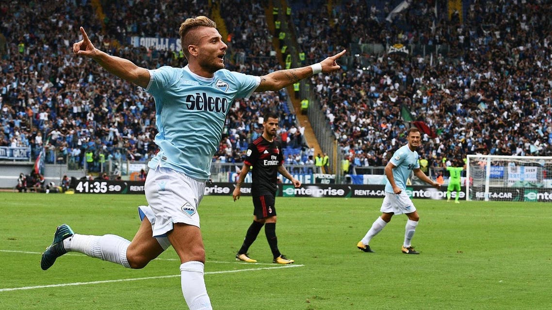 Lazio's forward from Italy Ciro Immobile celebrates after scoring his second goal during the Italian Serie A football match Lazio vs AC Milan on September 10, 2017 at the Olympic stadium in Rome. Vincenzo PINTO / AFP