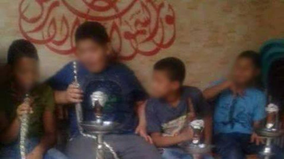 The minors can be seen smoking during the Eid Al Adha holiday
