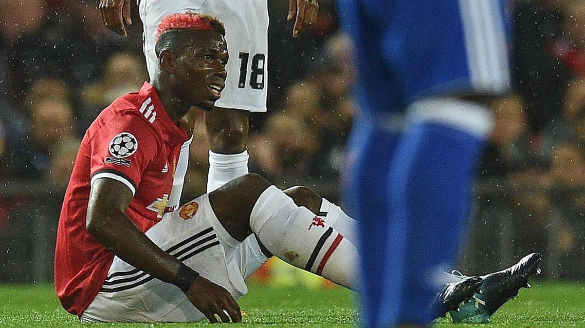 Manchester United's French midfielder Paul Pogba reacts following a challenge during the UEFA Champions League Group A football match between Manchester United and Basel at Old Trafford in Manchester, north west England on September 12, 2017. (AFP)