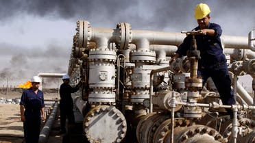 In this Dec. 13, 2009 file photo, Iraqi workers are seen at the Rumaila oil refinery, near the city of Basra, 550 km southeast of Baghdad, Iraq. (AP)