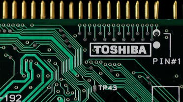 A logo of Toshiba Corp is seen on a printed circuit board in this photo illustration. (Reuters)