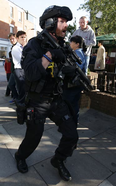 An armed British police officer works near Parsons Green underground tube station in west London on September 15, 2017, following an incident on an underground tube carriage at the station. (AFP)