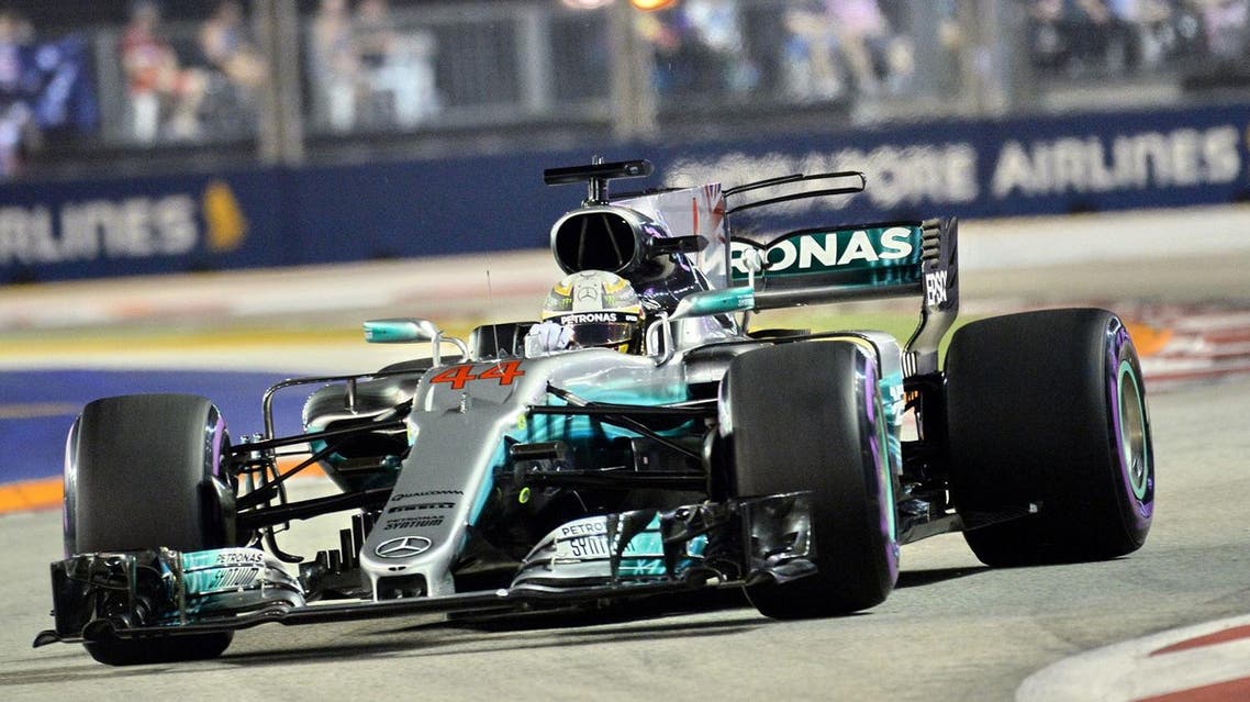 Mercedes' British driver Lewis Hamilton drives during the qualifying session of the Formula One Singapore Grand Prix in Singapore on September 16, 2017. (AFP)