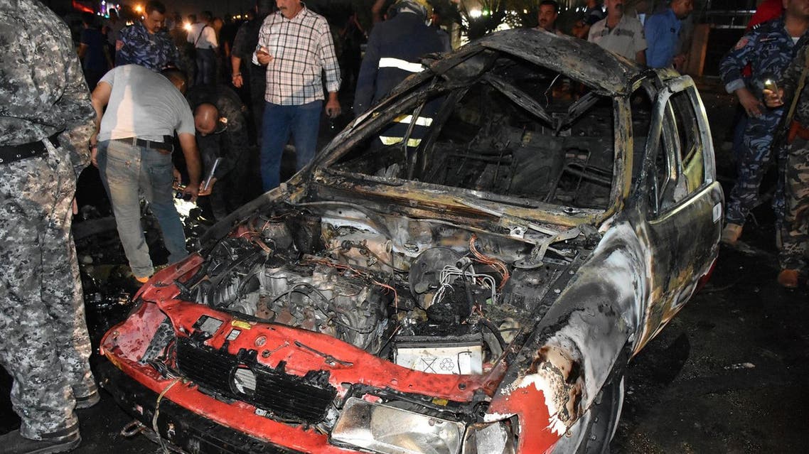 Iraqi security forces inspect the scene of a car bomb explosion that targeted a shop selling alcohol in the mainly Kurdish Iraqi city of Kirkuk on September 16, 2017. The blast comes as Kurdish leaders prepare to hold an independence referendum on September 25 in the face of fierce opposition from Baghdad and the Kurds' international backers. (AFP)