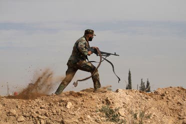 A Shia fighter clashes with members of the Free Syrian Army in the town of Hatita, in the countryside of Damascus, Syria on Nov. 22, 2013. (File photo: AP)