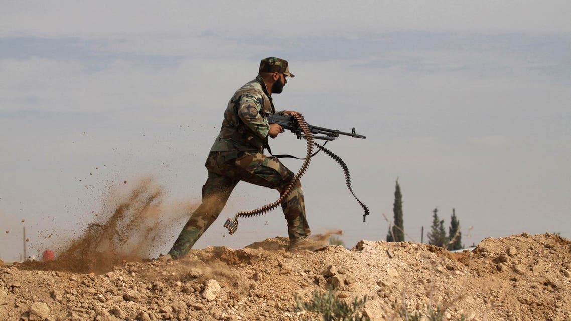 This Friday, Nov. 22, 2013 file photo, a Shiite fighter clashes with members of the Sunni-dominated Free Syrian Army rebel in the town of Hatita, in the countryside of Damascus, Syria. Aleppo is set to be recaptured by Syrian President Bashar Assad, but the victory will not be Assad's alone. The battle for Syria's largest city has attracted thousands of foreign forces, including Russian soldiers and thousands of fighters from Iran, Lebanon, Iraq and Afghanistan. (AP Photo/Jaber al-Helo, File)