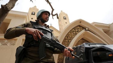A policeman stands in front of a church in Tanta, Egypt. (Reuters)