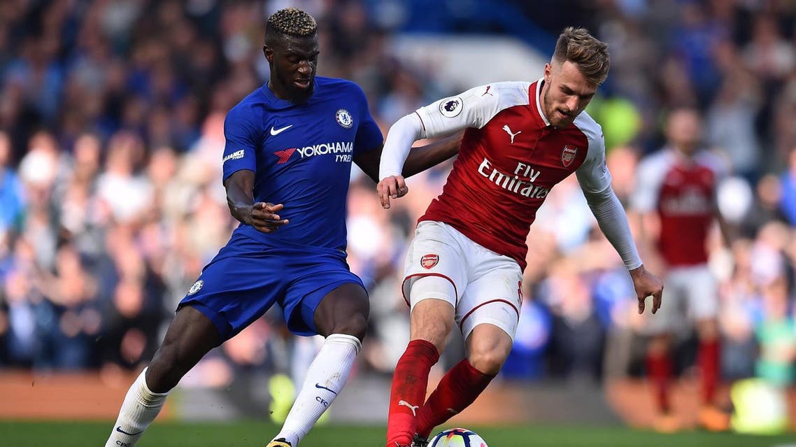 Arsenal's Welsh midfielder Aaron Ramsey (R) vies with Chelsea's French midfielder Tiemoue Bakayoko during the English Premier League football match between Chelsea and Arsenal at Stamford Bridge in London on September 17, 2017. (AFP)