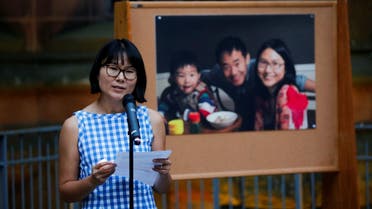 Hua Qu speaks to people as they attend a vigil for Xiyue Wang at Princeton University, New Jersey, US, on September 15, 2017. (Reuters)
