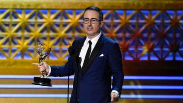 John Oliver accepts the award for outstanding writing for a variety series for "Last Week Tonight with John Oliver" at the 69th Primetime Emmy Awards on Sunday, Sept. 17, 2017, at the Microsoft Theater in Los Angeles. (Photo by Chris Pizzello/Invision/AP)