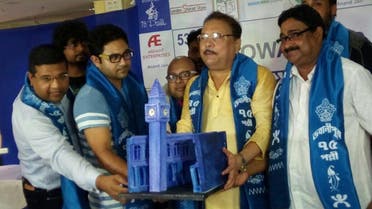 Madan Mitra displays a miniature Big Ben while announcing that replicas of London’s landmarks will add colour to Durga Puja this year. (Supplied)