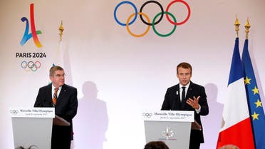 French President Emmanuel Macron (right) and President of the International Olympic Committee (IOC) Thomas Bach attend a press conference in Marseille, France, on September 21, 2017. (Reuters)