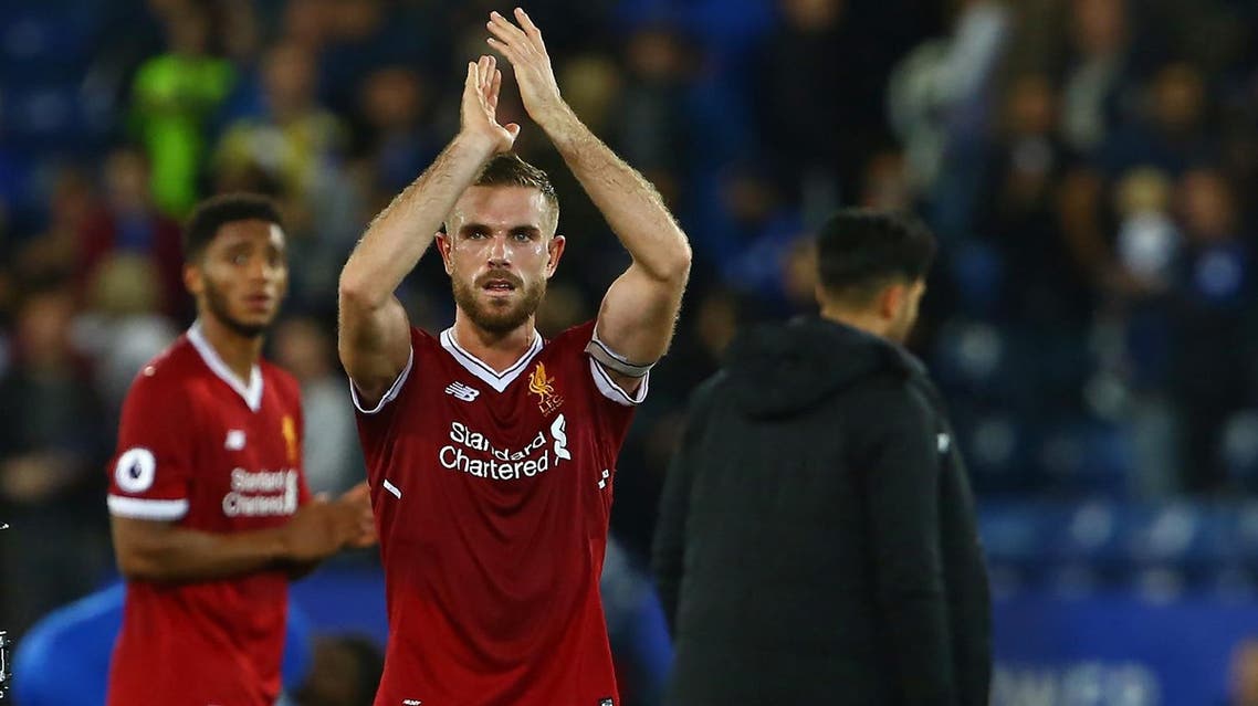 Liverpool's English midfielder Jordan Henderson applauds supporters on the pitch after the English Premier League football match between Leicester City and Liverpool at King Power Stadium in Leicester, central England on September 23, 2017. Liverpool won the game 3-2. (AFP)