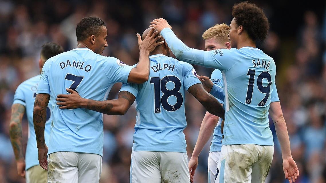 Manchester City's English midfielder Fabian Delph (C) celebrates with teammates after scoring their fifth goal during the English Premier League football match between Manchester City and Crystal Palace at the Etihad Stadium in Manchester, north west England, on September 23, 2017. (AFP)