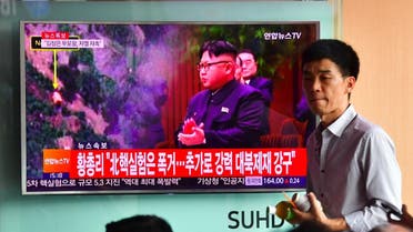 People watch a television news report, showing file footage of North Korean leader Kim Jong-Un, at a railway station in Seoul on September 9, 2016. North Korea claimed September 9 it has successfully tested a nuclear warhead that could be mounted on a missile, drawing condemnation from the South over the "maniacal recklessness" of young ruler Kim Jong-Un. (AFP)