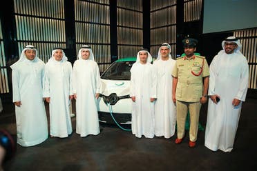 Dubai officials with electric car and charging station during a press conference in Dubai. (Supplied)