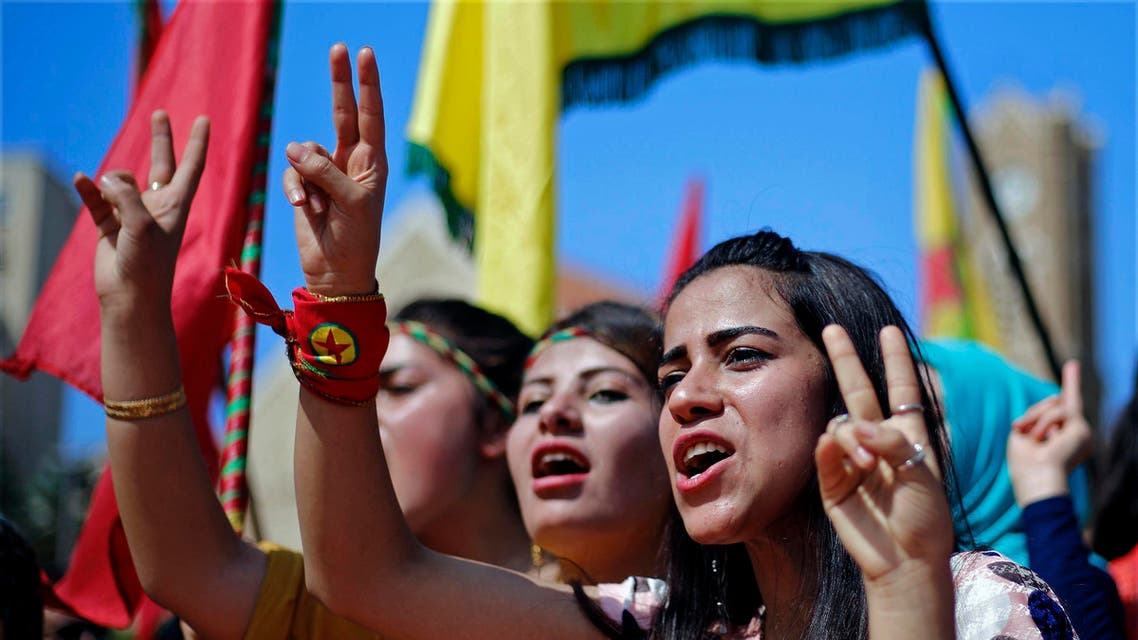 Supporters of the Kurdistan Workers' Party, known as the PKK, chant slogans as they flash victory signs during a demonstration in Lebanon. (AP)