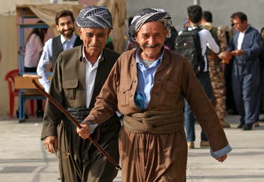 Iraqi Kurds arrive to cast their votes in the Kurdish independence referendum at a polling station in Erbil, on September 25, 2017. (AFP)