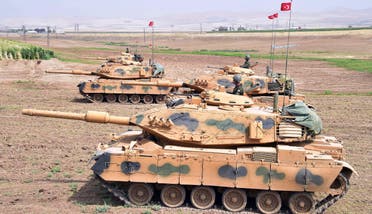 In this photo taken Saturday, Sept. 23, 2017, Turkish army tanks move during maneuvers in Silopi, near Habur border gate with Iraq, southeastern Turkey. (AP)