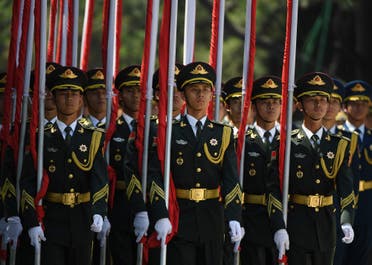 Chinese military flag bearers march out for a welcome ceremony for Cambodia’s Prime Minister Hun Sen outside the Great Hall of the People in Beijing on May 16, 2017. (AFP)