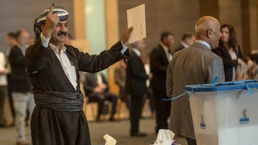 An officials of Kurdistan Regional Government (KRG) shows his ink-stained finger after casting his vote in the Kurdish independence referendum at a hotel in Arbil on September 25, 2017. Iraqi Kurds voted in an independence referendum, defying warnings from Baghdad and their neighbours in a historic step towards a national dream. (AFP)