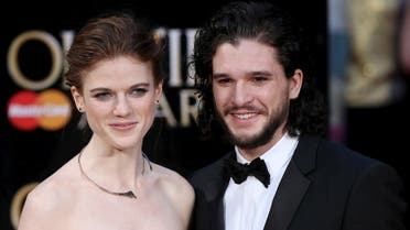 British actors Kit Harington (R) and Rose Leslie pose for photographers as they arrive at the Olivier Awards at the Royal Opera House in London, Britain, April 3, 2016. (Reuters) 