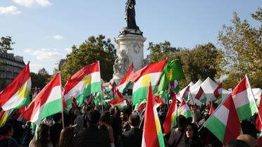 People hold Kurdish flags on September 22, 2017, on the Place de la Republique in Paris, as they attend a gathering in support of a "yes" vote ahead of an independence referendum for Iraqi Kurdistan due to be held on September 25. Iraq's Kurds have faced mounting international pressure, including from neighbouring Iran and Turkey, to call off the referendum that the UN Security Council has warned was potentially destabilising. (AFP)