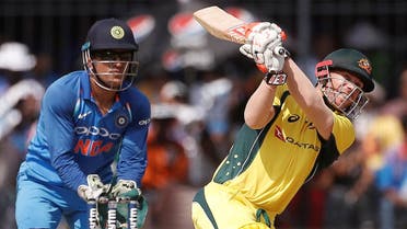David Warner plays a shot as India’s wicket-keeper Mahendra Singh Dhoni (left) looks on. (Reuters) 