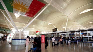 Passengers walk towards the check-in counters at Erbil International Airport, Iraq September 27, 2017. (Reuters)
