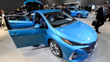 ournalists look at the redesigned Toyota Motor Prius PHV (plug-in hybrid vehicle) during a press conference in Tokyo on February 15, 2017.  (AFP)