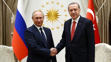 President of Russia, Vladimir Putin (L) shaking hands with Turkish President Recep Tayyip Erdogan (R) at Presidential Complex in Ankara during an official visit. (AFP)