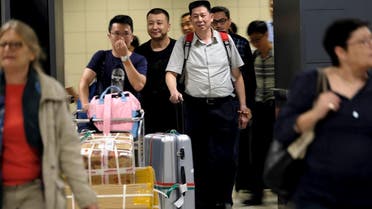International passengers exit the transit area after clearing immigration and customs on arrival at Dulles International Airport, Virginia, US, on September 24, 2017. (Reuters)