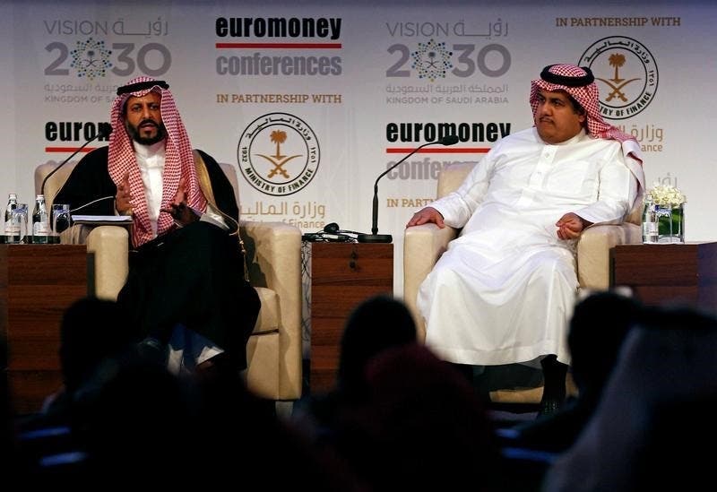 خالد الحصان المدير التنفيذي للسوق، ومحمد القويز رئيس هيئة السوق المالية بالسعودية