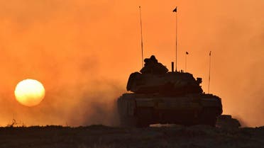 In this photo taken Friday, Sept. 29, 2017, a Turkish army tank moves, in Silopi, near the Habur border gate with Iraq, southeastern Turkey. (AP)